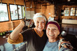 © Davor - Happy elderly female duo taking a selfie at the gym