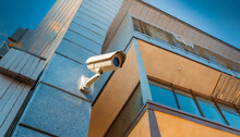 Security Camera On The Corner Of A Modern Building Based On Generative Ai