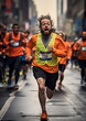 © atdigit - Marathon Runners in Orange Shirts on City Street