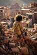 shaken Morocco, lonely and helpless child sitting on ruins