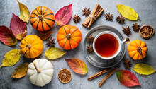 Hot Tea With Fall Foliage Pumpkins Cinnamon Sticks And Star Anise Colorful Autumn Leaves For Happiness Mood Grey Stone Table Top View