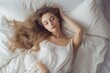young beautiful woman sleeping in a white bed