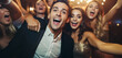 Happy multiracial friends taking selfies at a Christmas party.  A group of young people smiling for the camera at a nightclub. Friends having fun at a party.  Concept of youth culture and friendship