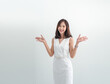 © Singh - Business woman portrait Asian one person wearing white dress Smiling brightly, cheerful, happy standing looking new project job ready for work inside ready for work inside office with white background