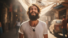Happy Bearded Arab Man In Middle East, Portrait Of Smiling Guy On City Street. Young Person Wearing T-shirt Laughing Outdoor. Concept Of Character, People, Muslim, Face, Youth, Islam