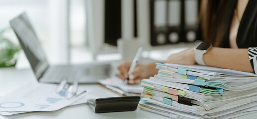 business documents businessman check legal document review Prepare documents or analysis reports, tax items, accounting documents, data contracts, office partner agreements.
