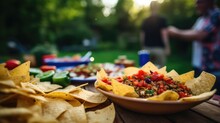 Tortilla Chips And Bean Dip Served At An Outdoor Party