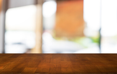 Sticker - Mock up for space. Empty dark wooden table in front of abstract blurred bokeh background of restaurant . can be used for display or montage your product