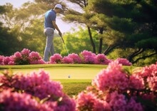A Golfer Lining Up A Putt On A Beautifully Landscaped Green, With Flowers Blooming In Vibrant