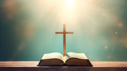 Open holy book Bible on a green background with a glowing cross.