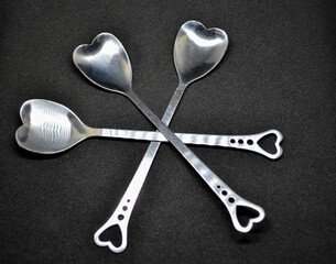 spoons for valentine 's day on blackground  