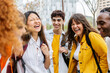 © Xavier Lorenzo - High school students group having fun outdoor after class. Diverse young people laughing standing together at college campus. Youth, education and academic community concept.