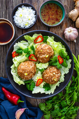 Wall Mural - Lion's head meatballs - steamed big meatballs served with vegetables on wooden background 