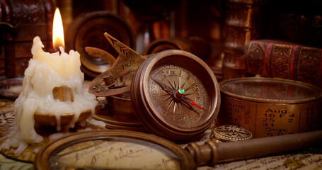 Wall Mural - Vintage style travel and adventure. Vintage old compass and other vintage items on the table.