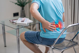 Fototapeta  - Lumbar intervertebral spine hernia, man with back pain at home, spinal disc disease