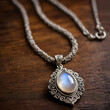 © Max Entropy - Moonstone pendant lying on a dark oak wood table