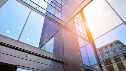 Wall Mural - Abstract reflection of modern city glass facades. Modern office building detail, glass surface.