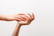 © looking2thesky - Beautiful Woman Hands. Female Hands Applying Cream, Lotion. Spa and Manicure concept. Female hands with french manicure. Soft skin, skincare concept. Hand Skin Care.