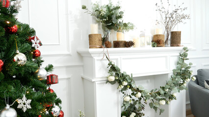 Blurred Background Christmas tree decorated holiday winter xmas celebration. Present gift decorate under bauble ornament silver red ball on christmas tree in cozy living room. Blurry background