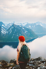 woman tourist traveling in norway girl hiking alone outdoor with backpack enjoying mountains view ad