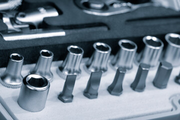 Hardware toolkit with many different garage equipment. Automobile fix background. Screwdriver metal bits set