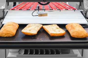 Poster - Sliced white bread in a cutting machine