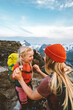 © EVERST - Family adventures Mother traveling with daughter child having fun outdoor hiking together active vacations in mountains 4 years old kid girl with backpack healthy lifestyle tour