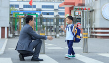 Father And Son At The School Gate