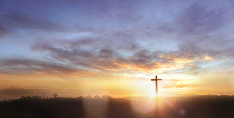 Wall Mural - Christian wooden cross on sunset background