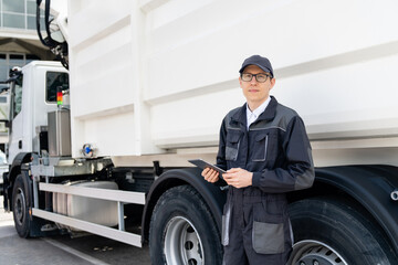 Poster - Manager with a digital tablet next to garbage truck