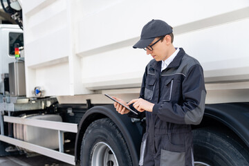 Poster - Manager with a digital tablet next to garbage truck