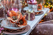 Xmas festive table decorations. Romantic beautiful festive Christmas table setting. 