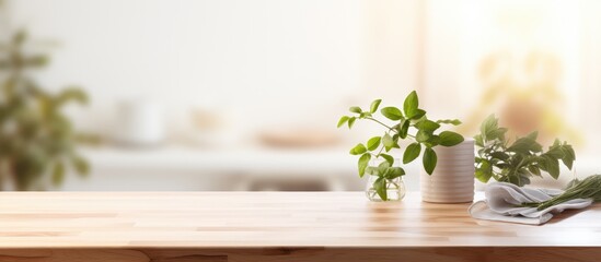 Wall Mural - Wooden tabletop with free space for product display against blurred white kitchen with cutting board and plant in Scandinavian style lighting