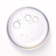 Moisturizing, bubbly glycerin liquid gel dropping onto a white surface.