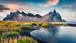 Majestic summer scene of Stokksnes headland with Vestrahorn (Batman Mountain) on background. Unbelievable evening view of Iceland, Europe. Beauty of nature concept background
