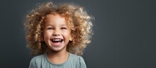 Cheerful Baby Girl With Curly Blonde Hair Brushing Teeth Isolated
