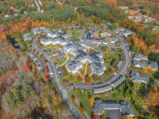 Sticker - Aerial view of suburban housing community in autumn season with colorful trees