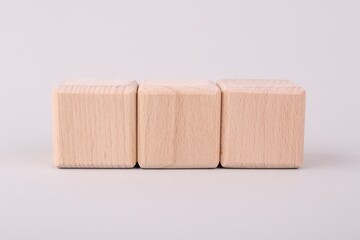 International Organization for Standardization. Cubes with abbreviation ISO on light grey background, closeup