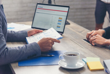 Happiness two businessman working together confident team meeting in office desk. Team business man partners working with laptop startup company. Asian man colleague friendship at work staff meeting