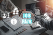 Job fair concept,Business team making handshake with his partner in office desk with job fair icon on virtual screen.