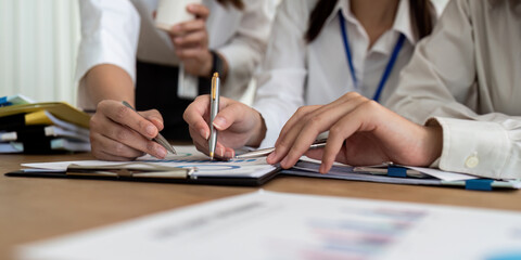 businesswoman hand hold pen and point at document to brainstorm about static