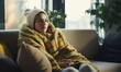 © ink drop - Winter fuel and energy costs. People wearing blankets and hats indoors to keep warm