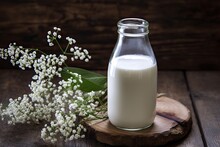Organic Dairy Elegance In Vintage Glass On Wooden Table. Rustic Nutrition. Creamy Milk And Dairy Products In Setting. Traditional Wellness. Fresh And Creamy Delights On Rustic Background
