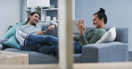 Canvas Print - Happy couple, tablet and phone in relax on sofa for online streaming, entertainment or social media at home. Man and woman lying on living room couch with smile for technology or networking at house