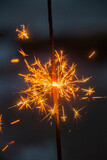 Fototapeta Sypialnia - Many sharp sparks in the form of stars from sparklers close-up