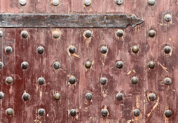 Poster - Detail of old wooden gate leaf part. Ancient wood door with metal rivets in Qaitbay Citadel, Alexandria, Egypt