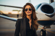 Young and successful woman standing with his privet jet
