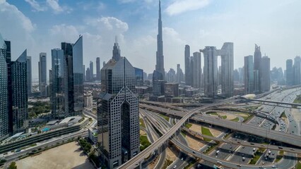 Wall Mural - Time lapse view of the skyline of Dubai City center and busy Sheikh Zayed road intersection, United Arab Emirates