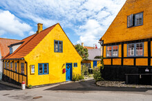 Denmark, Bornholm, Gudhjem, Empty Street Along Yellow Town Houses