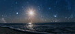 a star shines in the night sky over the sea on the holiday of Christmas
